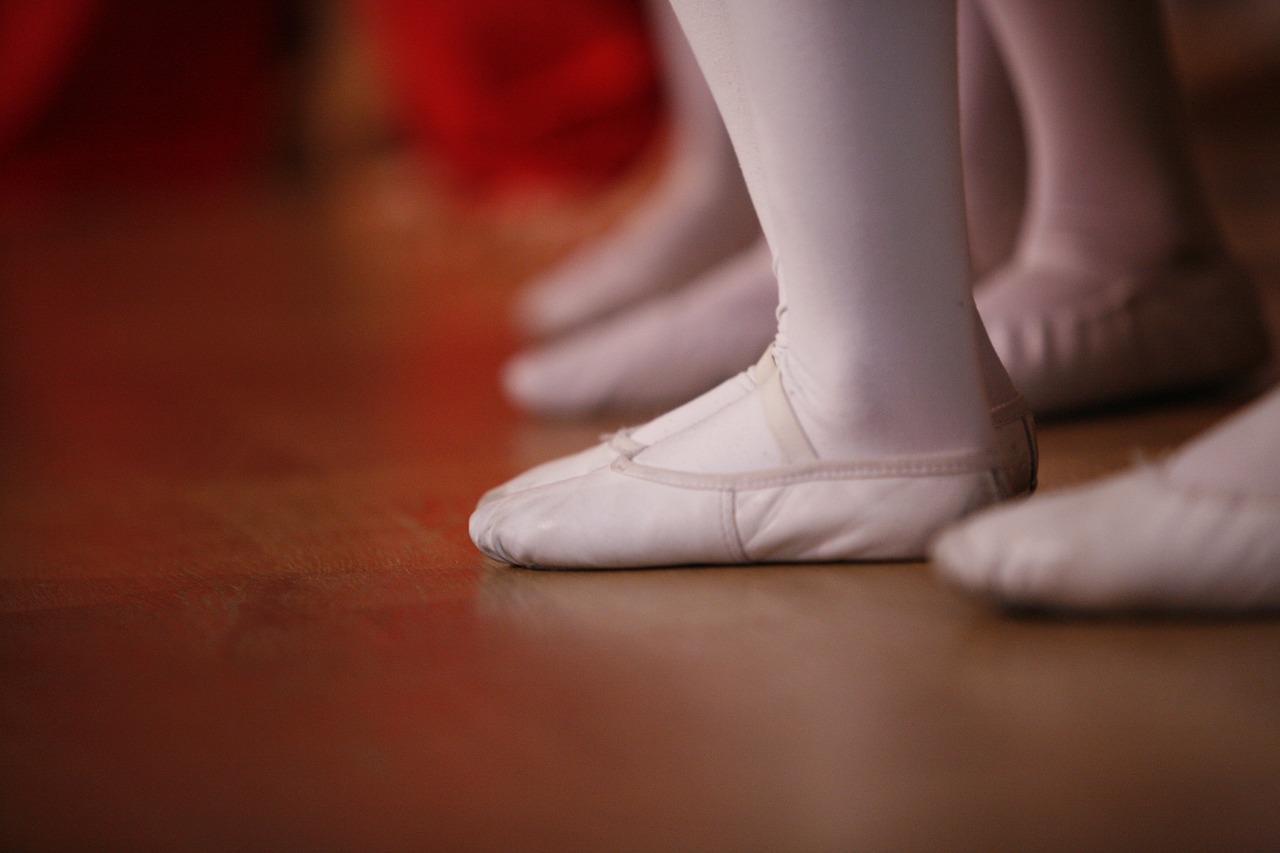 dance shoes beside rehearsal studio floor